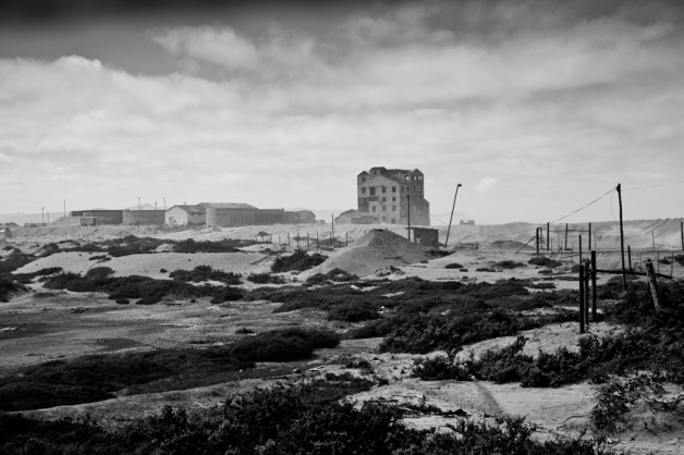 Abandoned diamond mining buildings just behind the coastal dunes near the !Gariep River mouth.
